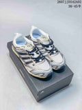 Pair of silver-toned adidas Adizero PR SFTM sneakers on a shoebox