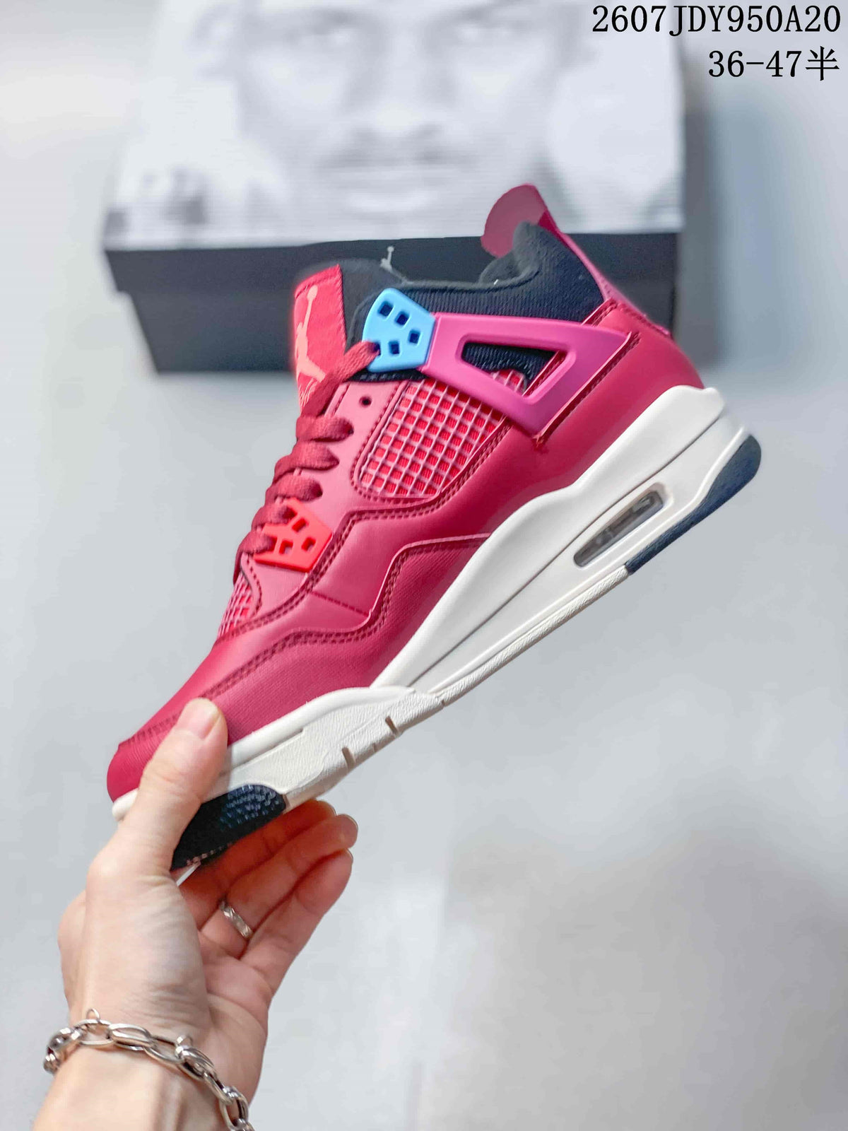 Side profile showing the pink upper, mesh panel, molded side support, white midsole, and visible side air window.