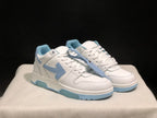 Three-quarter front view of the white and light blue sneaker pair with a light blue zip-tie-style accessory.