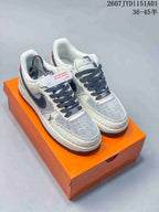 Pair of white and gray low-top sneakers with dark laces