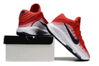 Red and white Nike GT Hustle 3 shoes displayed from the heel and side.