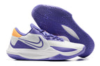 White and purple basketball shoe with orange heel details and a purple outsole.