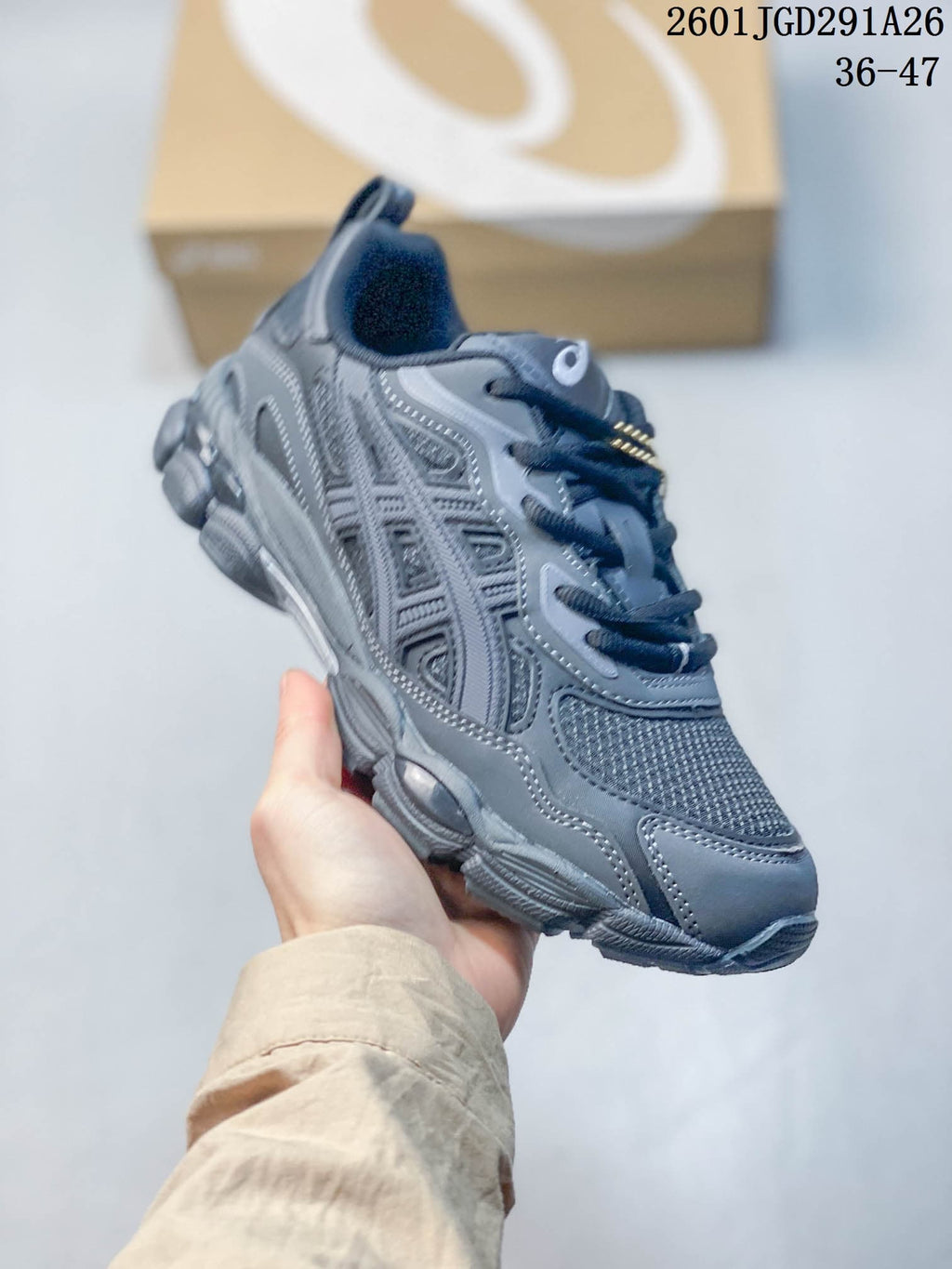 Angled side view showing the gray mesh upper, synthetic overlays, and outsole.