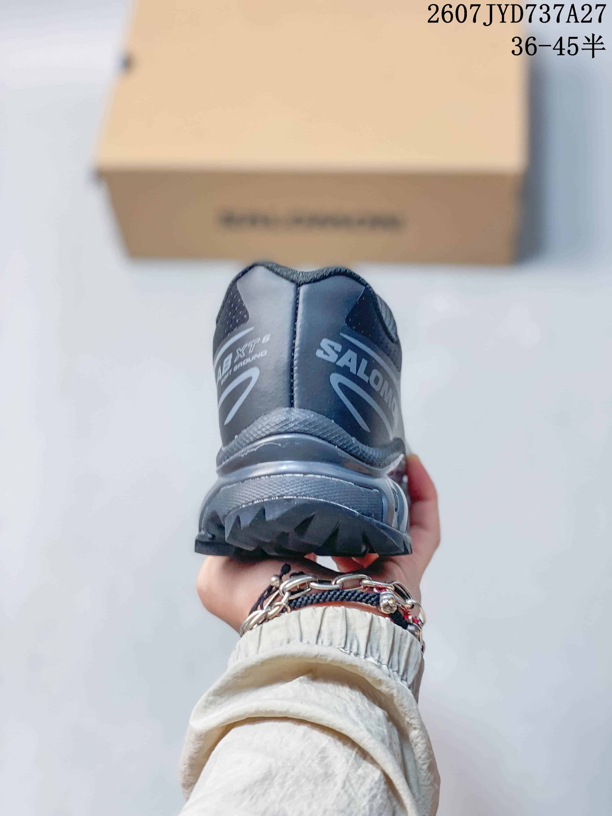 Rear view of the Salomon sneaker showing the padded heel, branding, and lugged outsole.