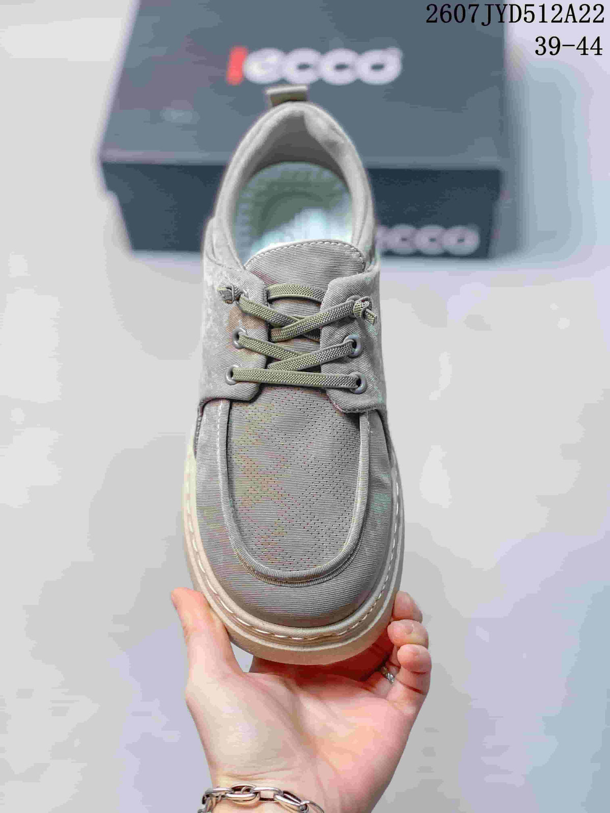 Top view of a gray ECCO lace-up sneaker showing the rounded toe, tongue, eyelets, and laces.