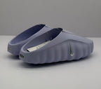 Rear three-quarter view showing the heel openings, side Swoosh, and heel branding details.