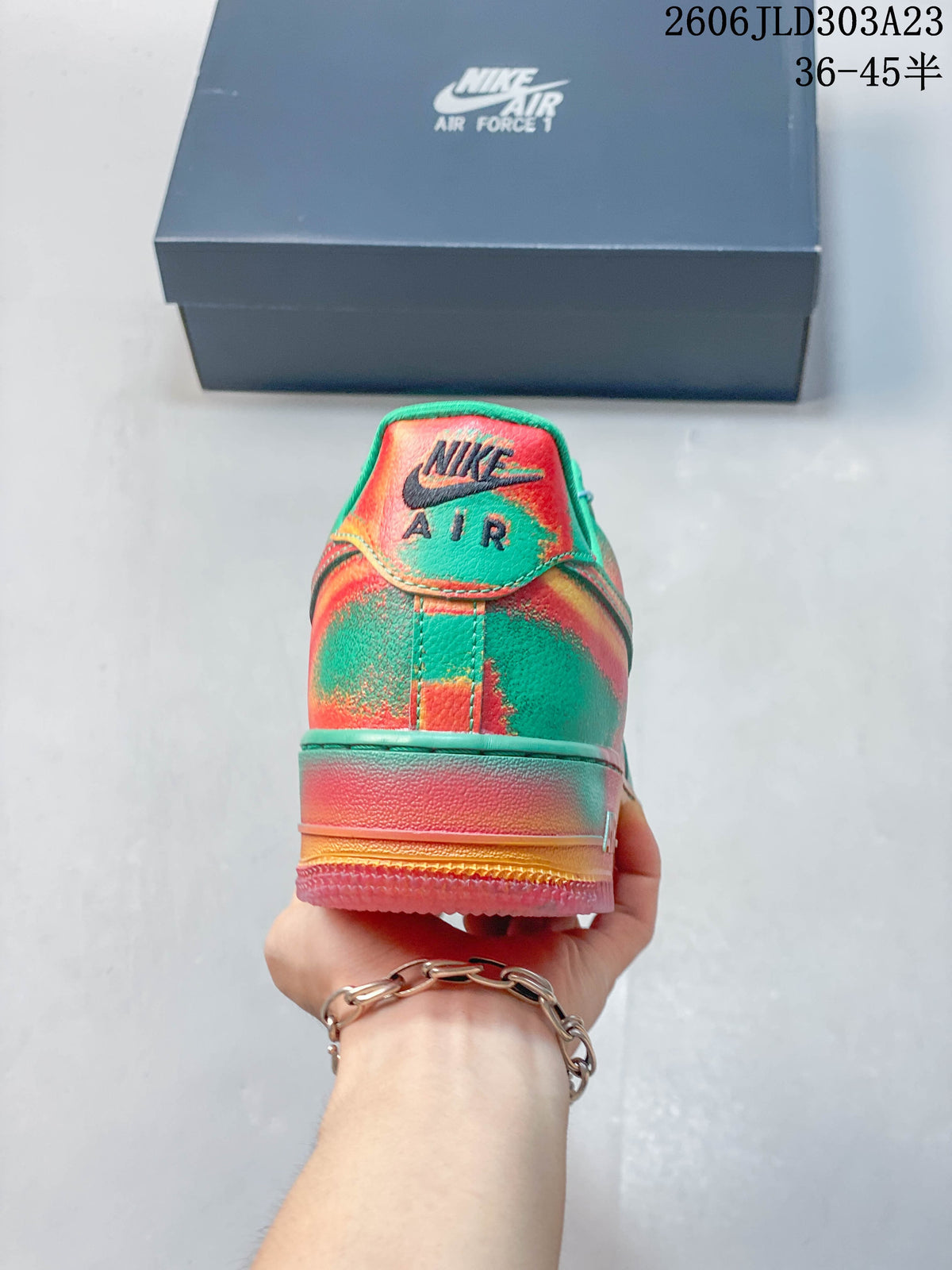 Rear view of the sneaker with multicolor panels and a gradient-colored sole