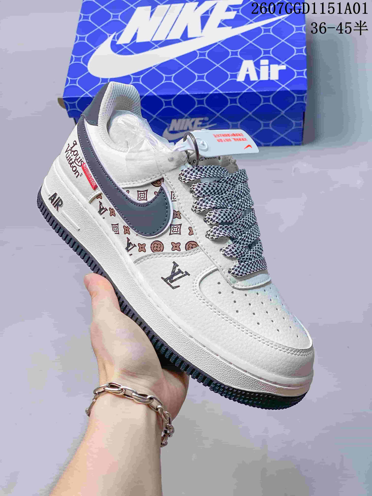 White and gray-blue Air Force 1-style sneaker with a dark Swoosh and patterned laces.