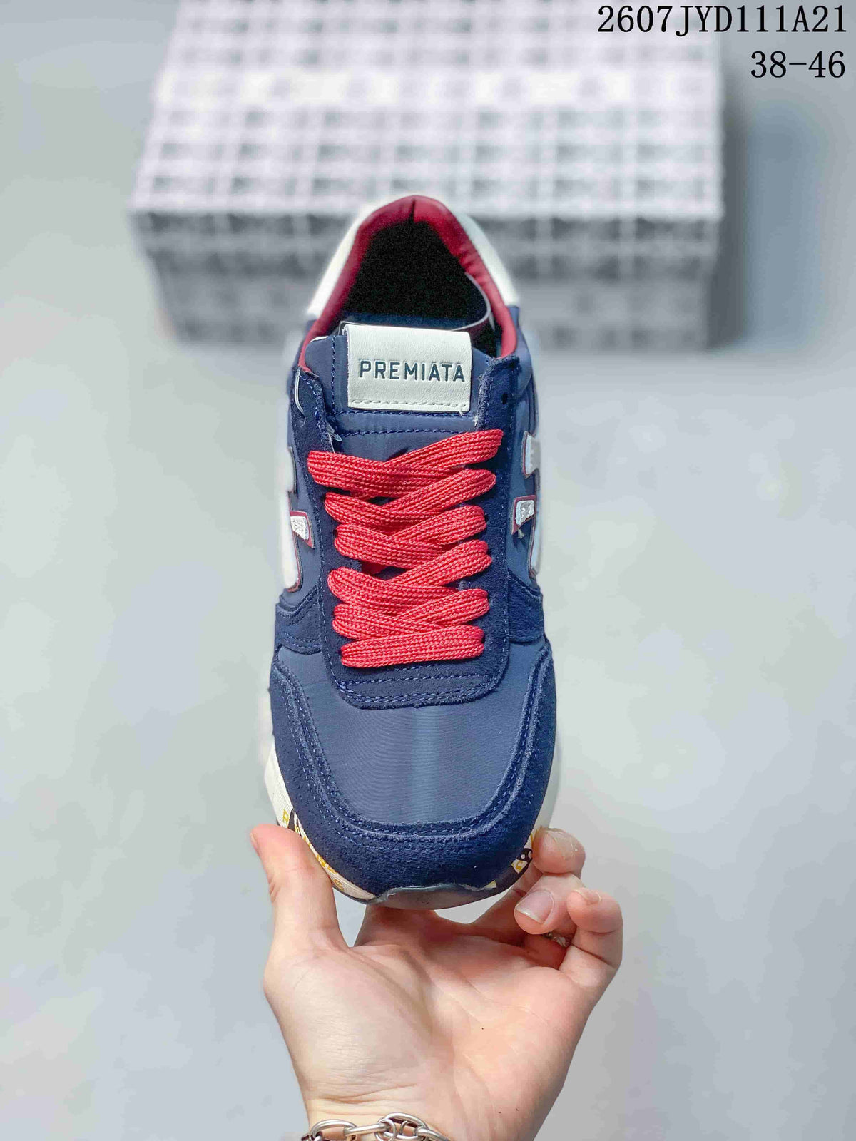 Top view of the sneaker showing the navy upper, red laces, padded collar and Premiata tongue label.