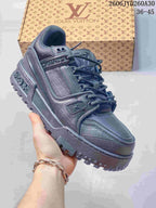 Dark metallic gray Louis Vuitton Trainer Maxi low-top sneaker with textured panels and dark laces.