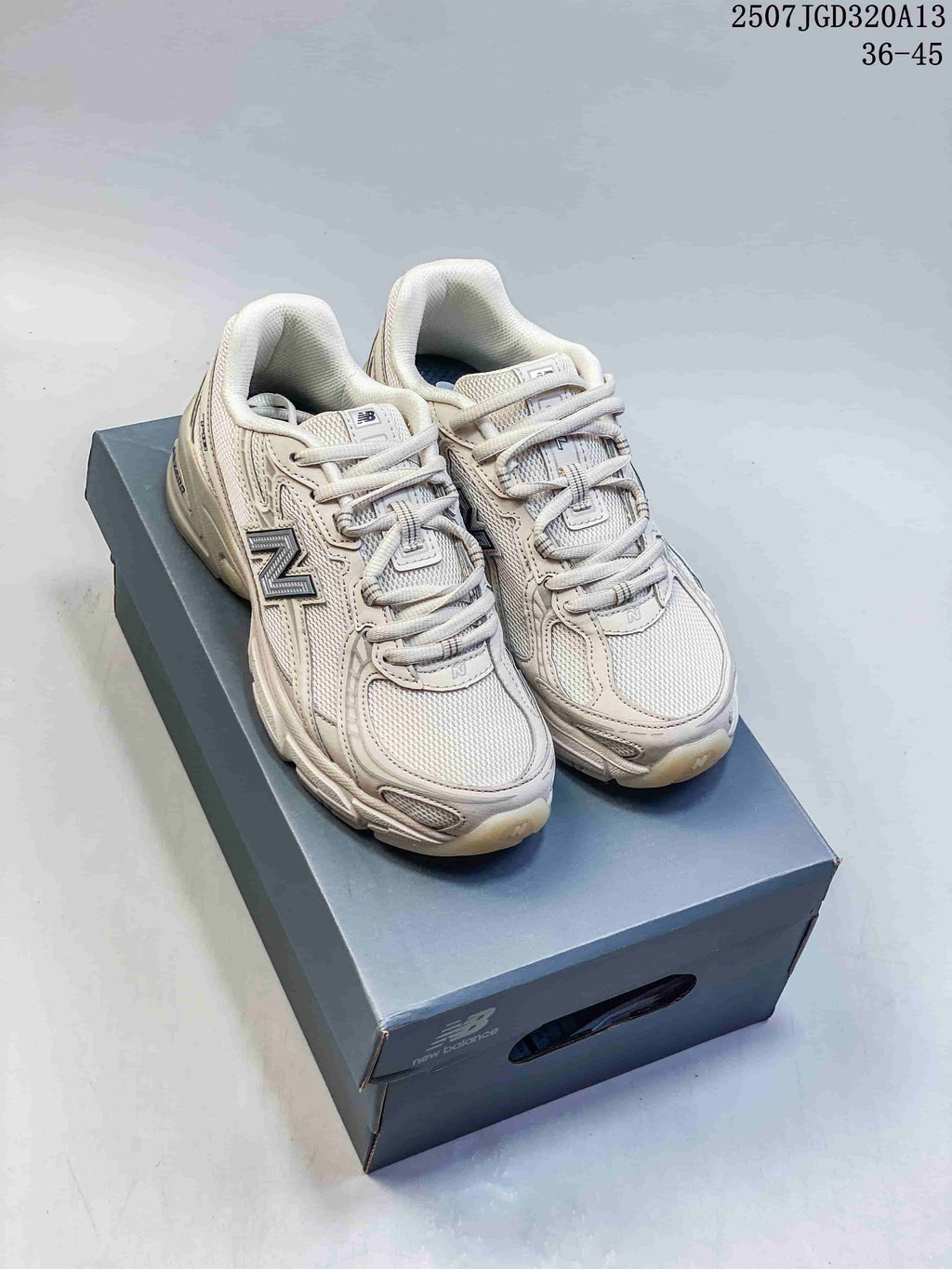 Pair of cream New Balance 740 sneakers displayed on a branded shoe box; the image also shows the text 36-45.