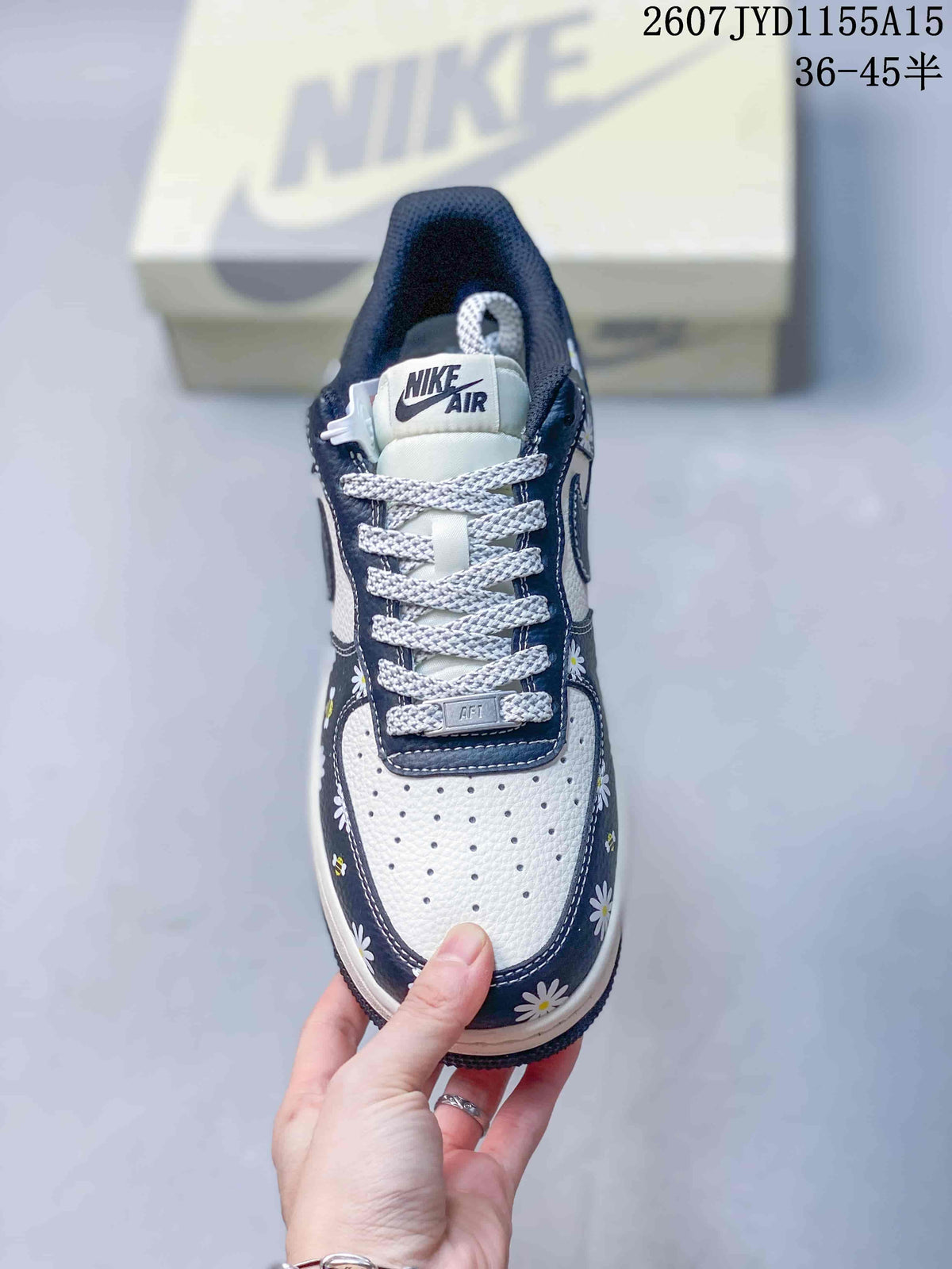 Top view showing the perforated white toe box, white laces, and navy floral trim.