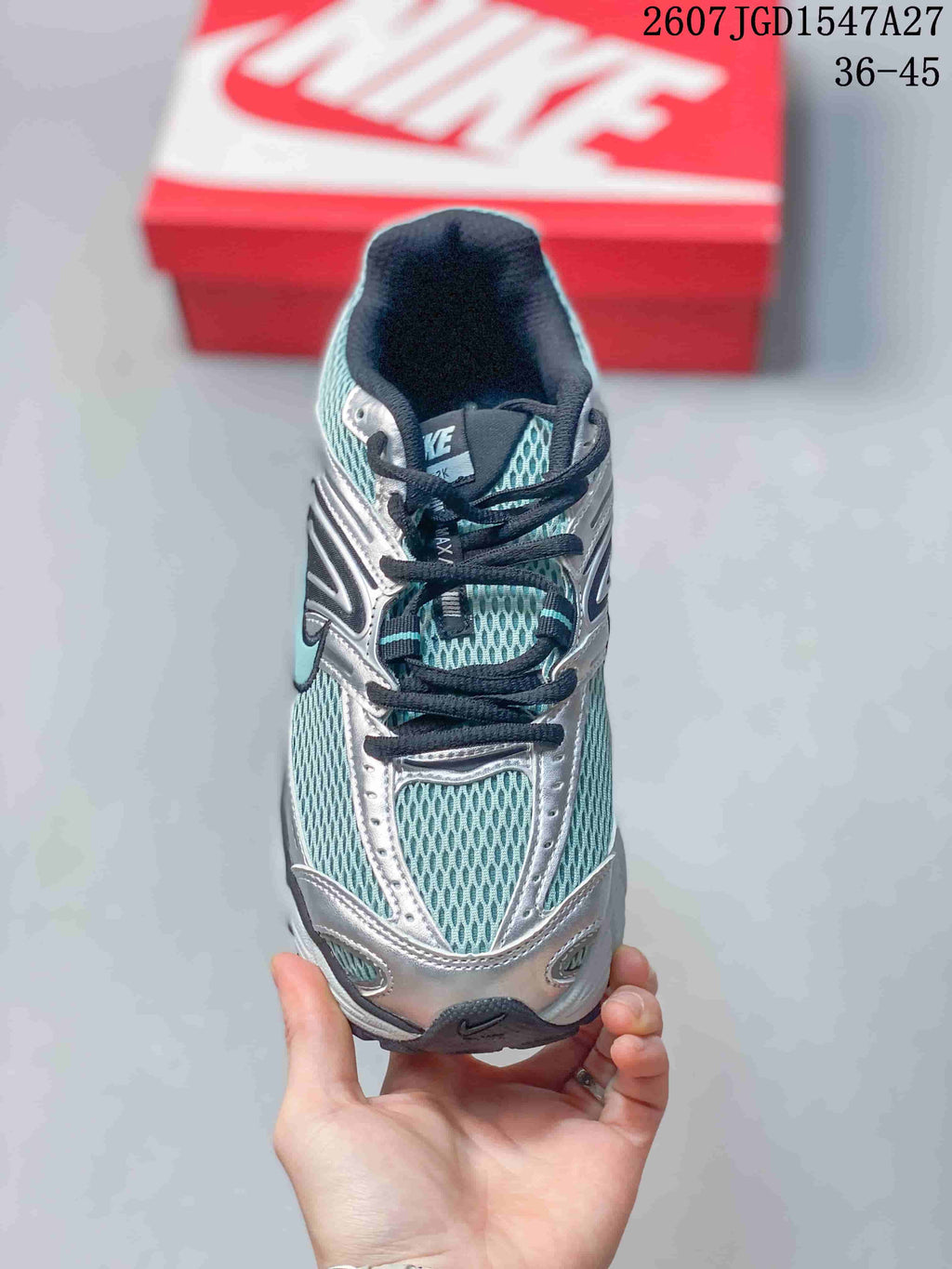 Top view showing the teal mesh toe box, silver overlays, black laces, and padded tongue.