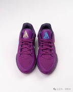 Pair of purple Nike Ja 1 shoes viewed from the front, showing contrasting tongue logos