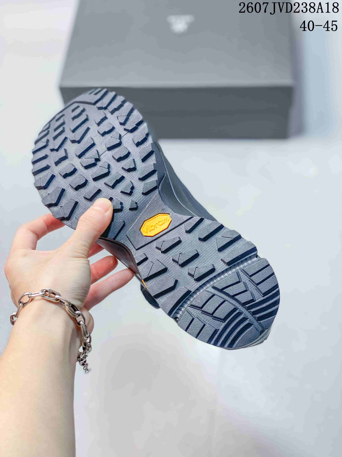 Close-up of the hiking shoe outsole showing a deep multidirectional tread pattern and a Vibram badge.