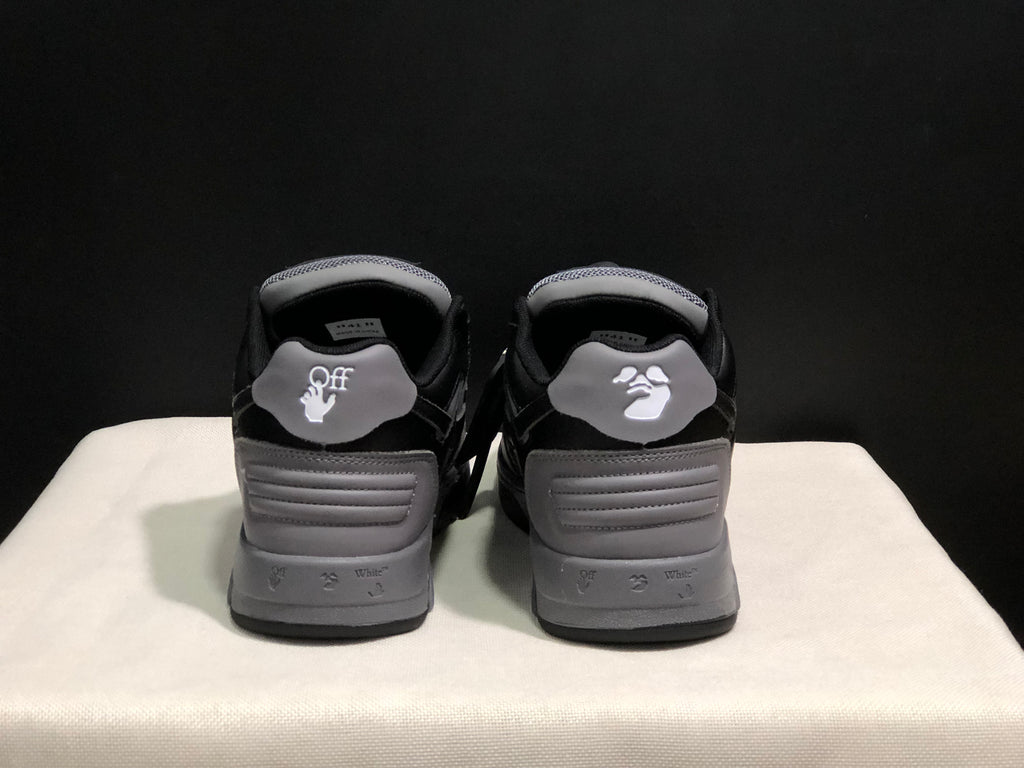 Rear view of the sneakers showing the heel panels and printed branding details.