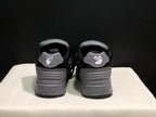 Rear view of the sneakers showing the heel panels and printed branding details.