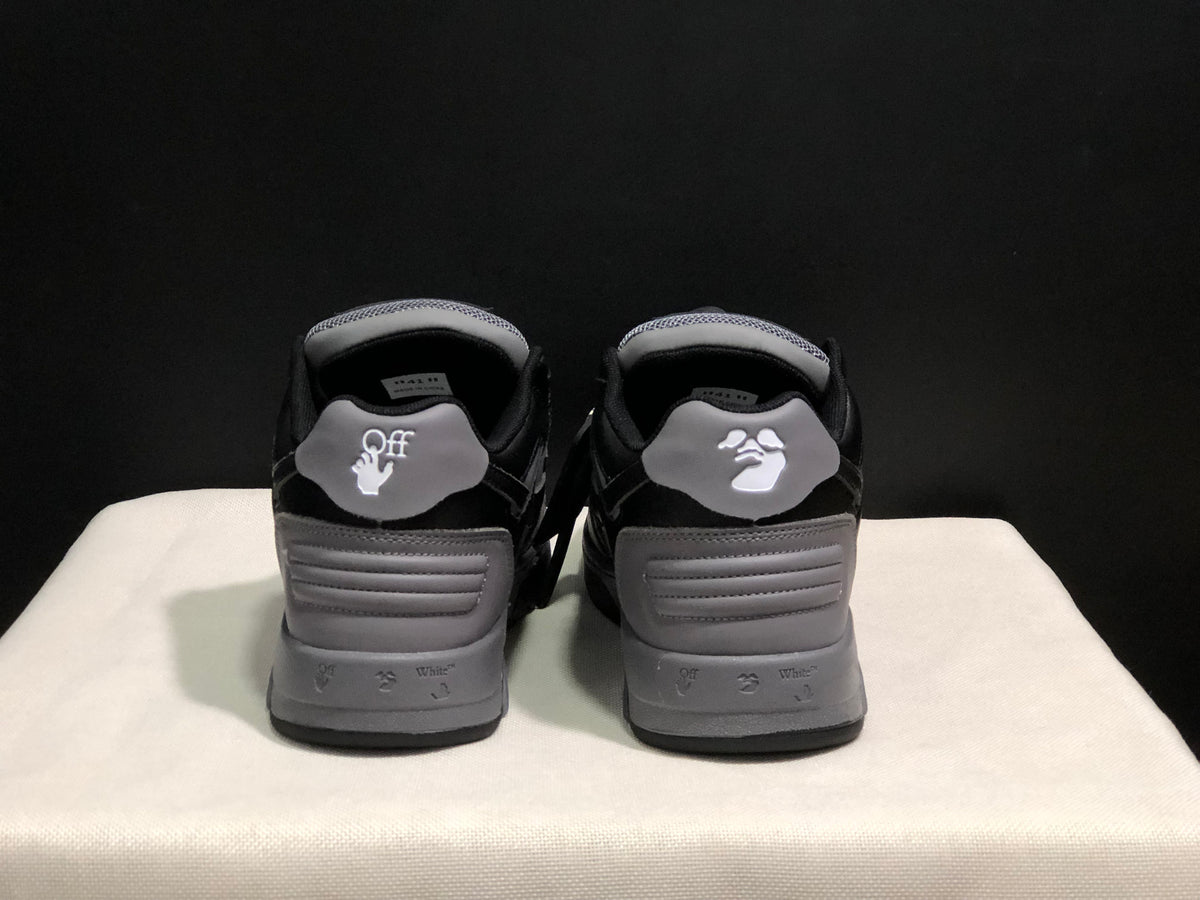 Rear view of the sneakers showing the heel panels and printed branding details.