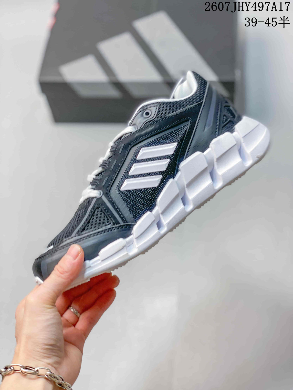 Side profile showing the dark mesh upper, white three-stripe branding, overlays, and segmented outsole.