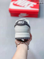 Rear view showing the padded heel, white midsole, dark outsole, and Nike branding on the heel tab.
