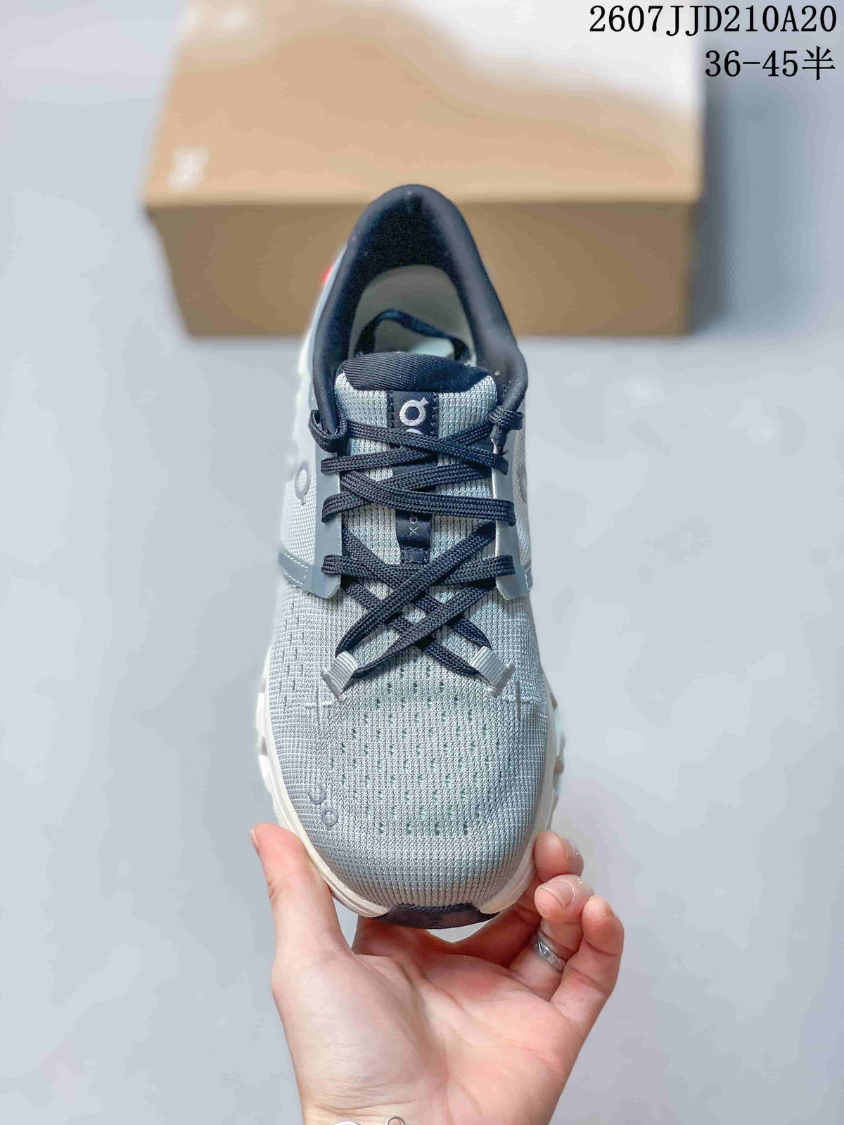Top view showing the gray textured upper, black laces, and perforated toe area.