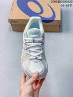 Top view of the lace-up sneaker showing the mesh toe area, padded tongue and light-colored lining.
