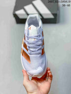 Top view of the white sneaker showing the laces, mesh-like tongue area and copper side accents; image text indicates 36–46.
