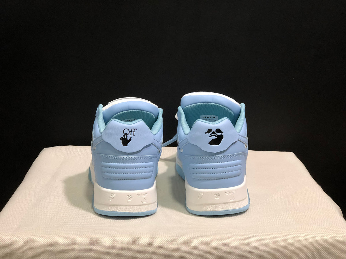 Rear view showing the contrasting heel details, printed graphics, and light blue outsole edges.
