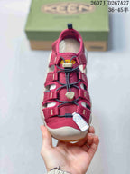 Top view of a burgundy KEEN sandal showing the layered straps, cord-style quick-lacing system, and front tag.