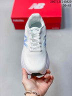 Top view showing the white lace-up design, padded collar and perforated toe area.