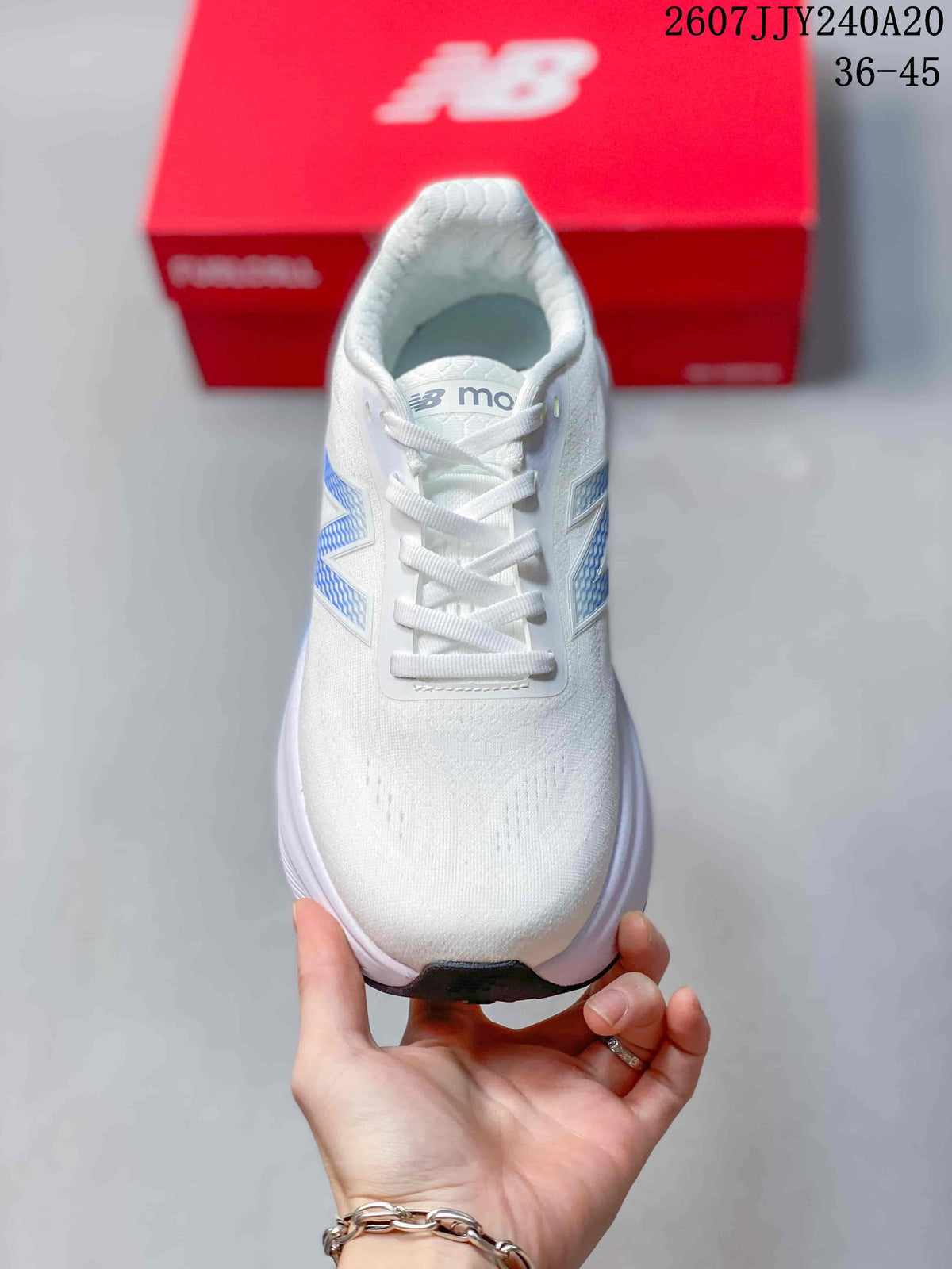 Top view showing the white lace-up design, padded collar and perforated toe area.