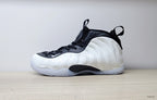 Opposite side profile of a white and black Nike Little Posite One GS sneaker