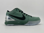 Side profile showing the green upper, black Swoosh and translucent outsole