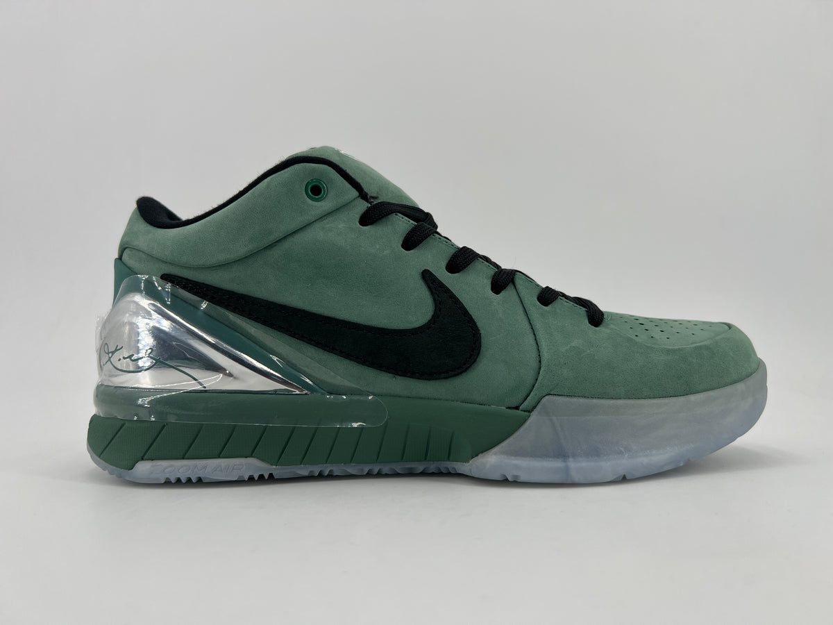 Side profile showing the green upper, black Swoosh and translucent outsole