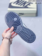 Underside view showing the navy rubber outsole traction pattern and Nike branding.