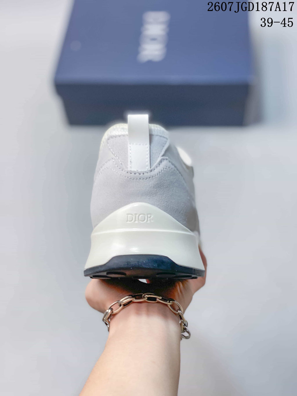 Rear view showing the gray heel panel, pull tab, raised white heel section, and dark outsole.
