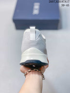 Rear view showing the gray heel panel, pull tab, raised white heel section, and dark outsole.