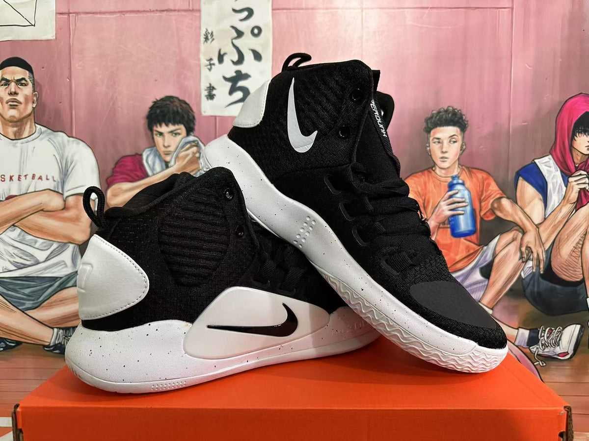 Angled view of the black and white high-top basketball shoes