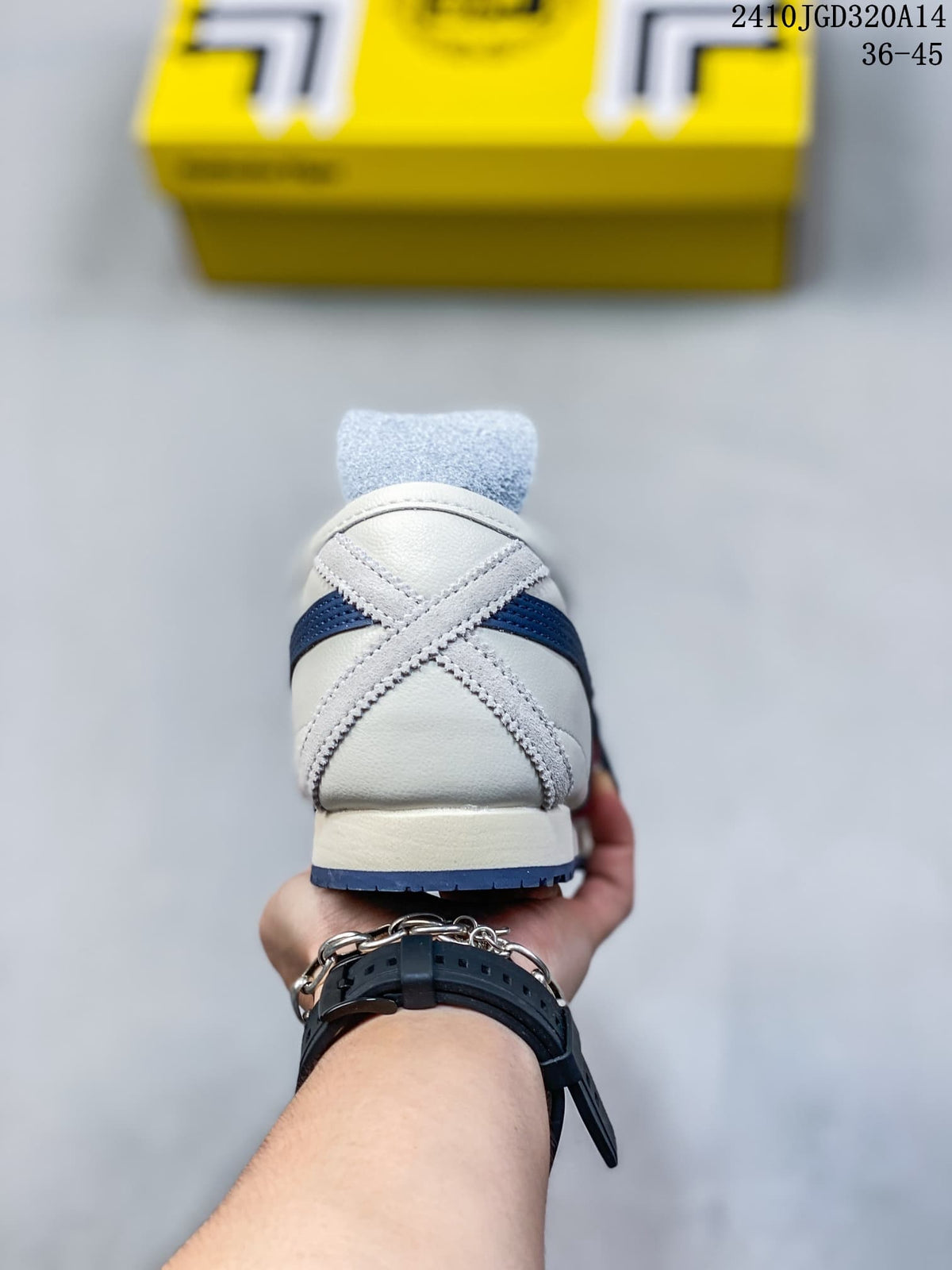 Rear view showing the crossed heel reinforcement detail, white upper, and dark blue outsole edge.