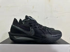 Side view of an all-black Nike sneaker with dotted Swoosh and ZoomX midsole marking