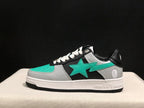 Side profile showing the turquoise star emblem, textured grey panels, black upper and white midsole.