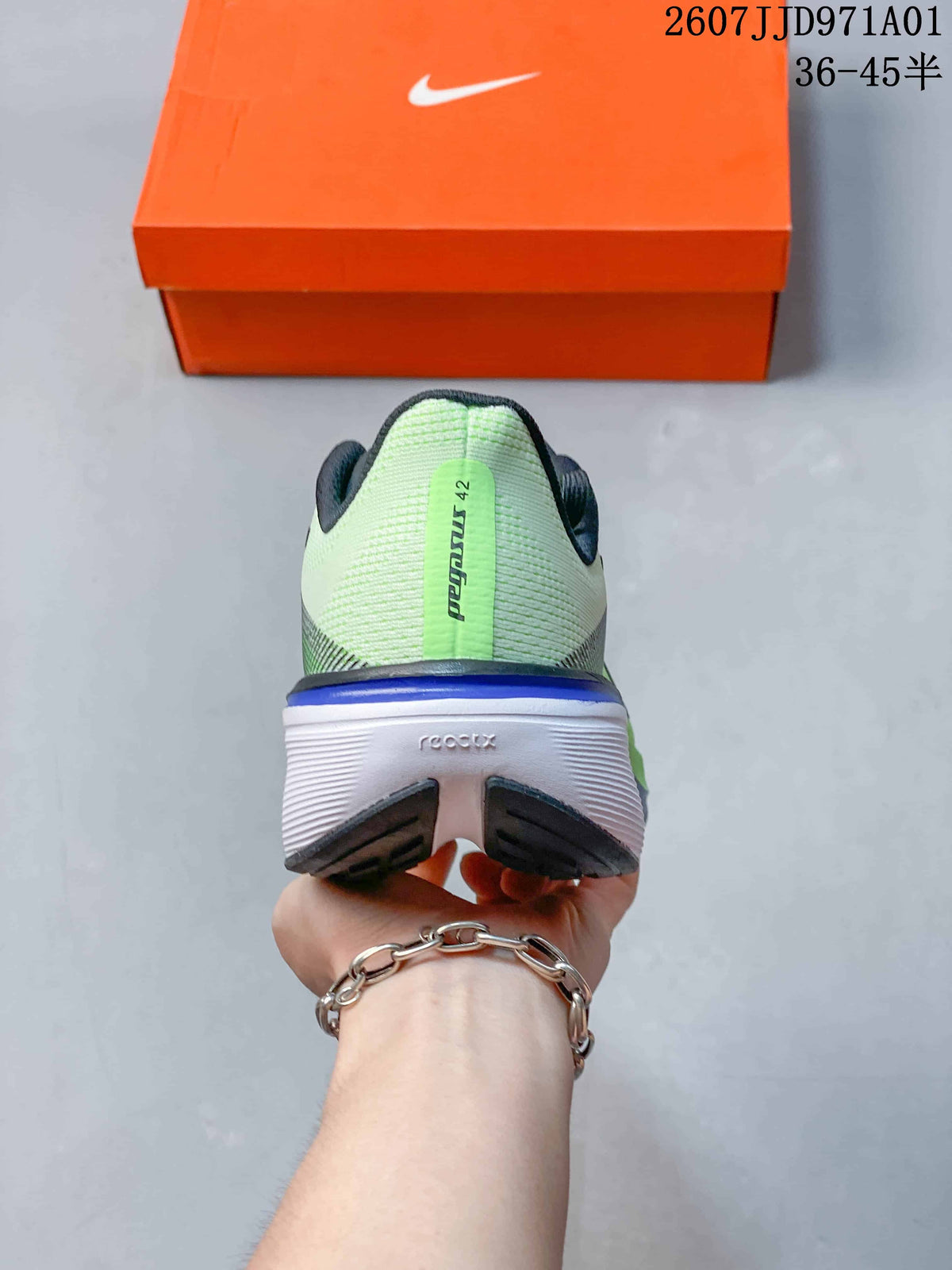 Rear view of a Nike Pegasus 42 shoe with a light green heel and white midsole