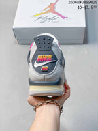 Rear view of the sneaker with a gray heel panel and colorful graphic details.