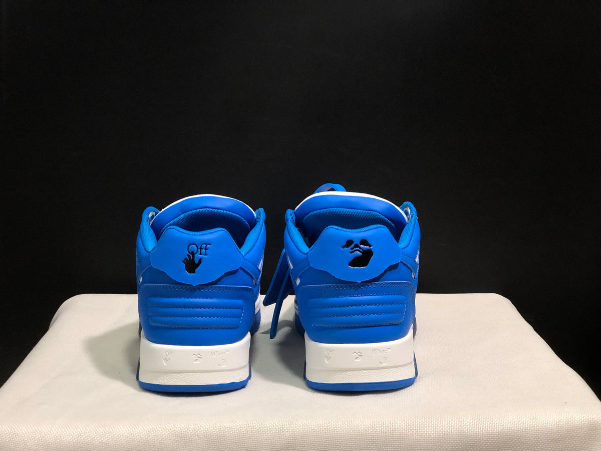 Rear view of the sneakers showing blue heel panels and decorative branding details.