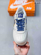 Top view showing the perforated white toe box, blue laces, and tongue label.