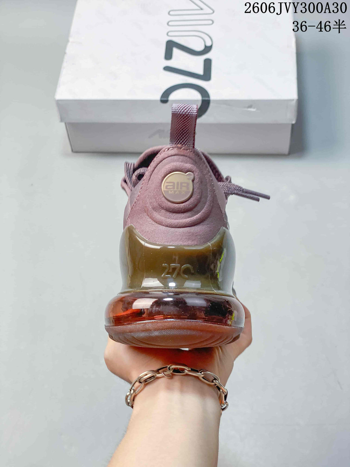 Rear view showing the heel air unit on a mauve sneaker