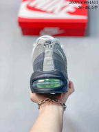 Rear view of the sneaker showing Nike Air branding and a visible green-tinted heel air unit.