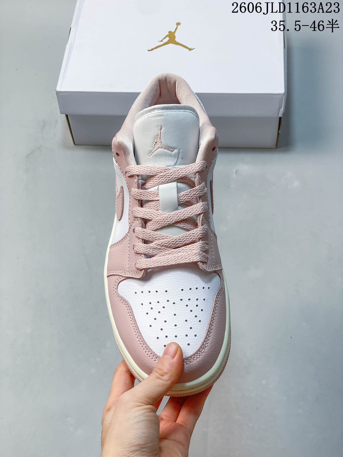 Front view showing pink laces and a perforated toe panel