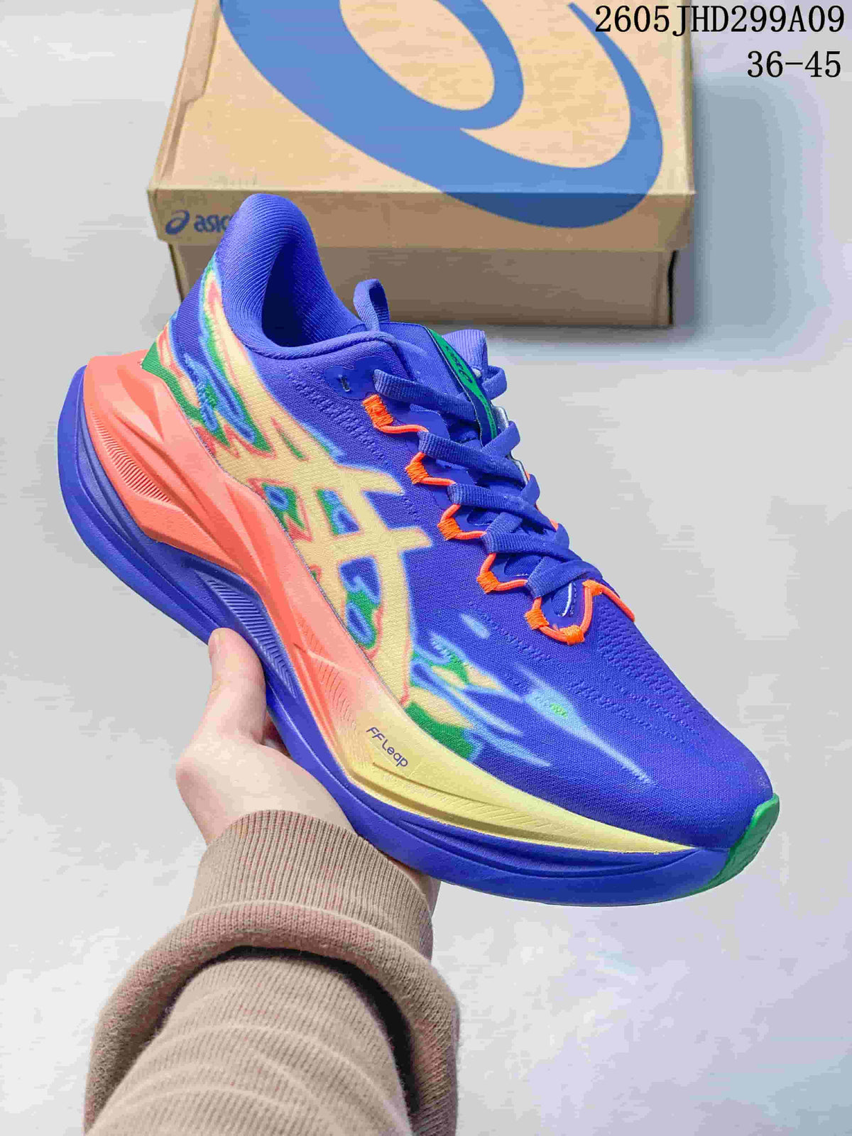 Lime green and pink ASICS Superblast 3 running shoe with multicolor side graphics