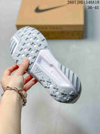 Close view of the sneaker outsole showing a white lugged tread pattern with circular openings.